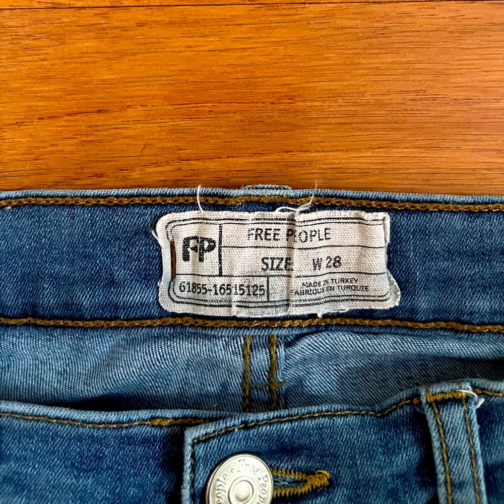 Free People open knee skinny jeans
